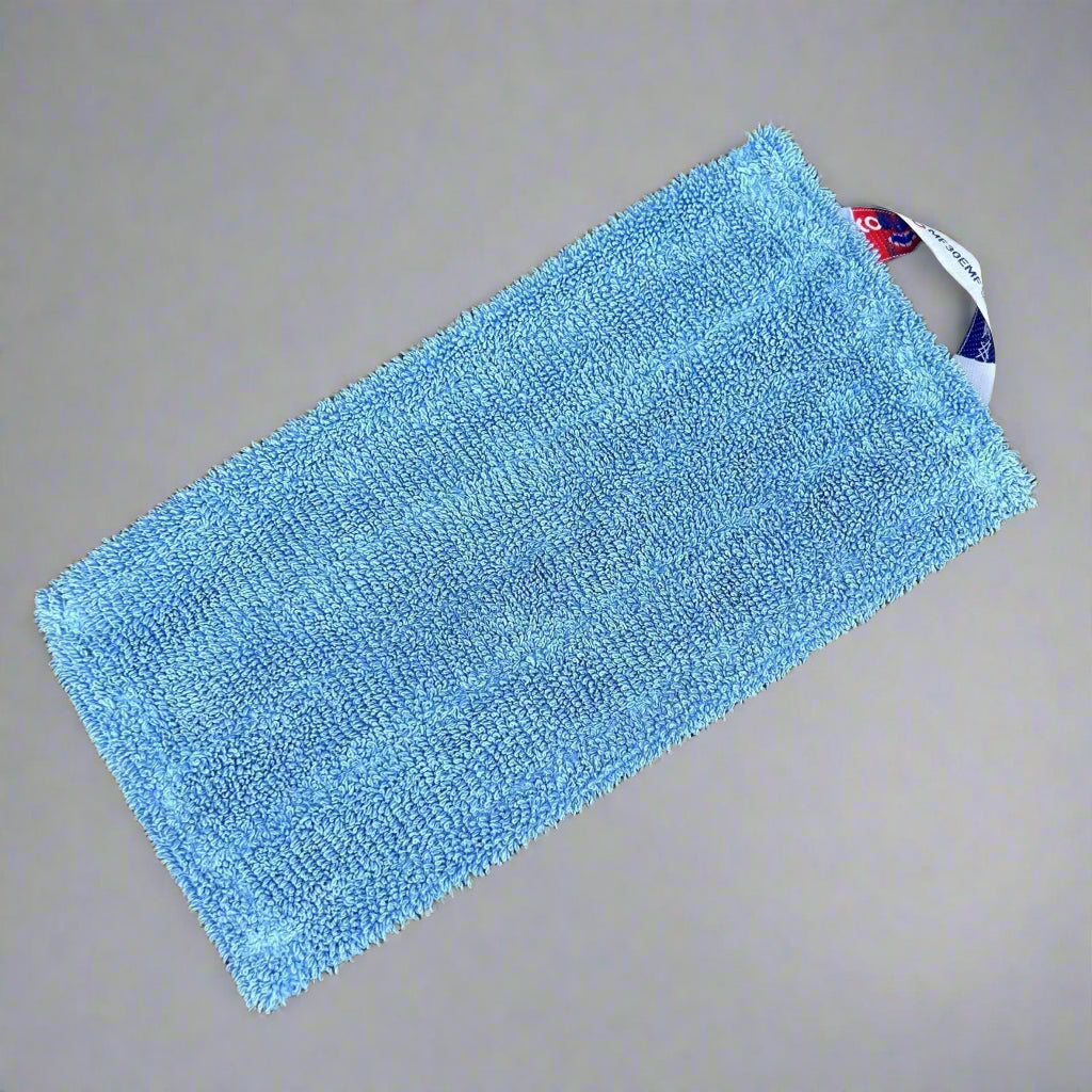 A blue contico flat mop head on display