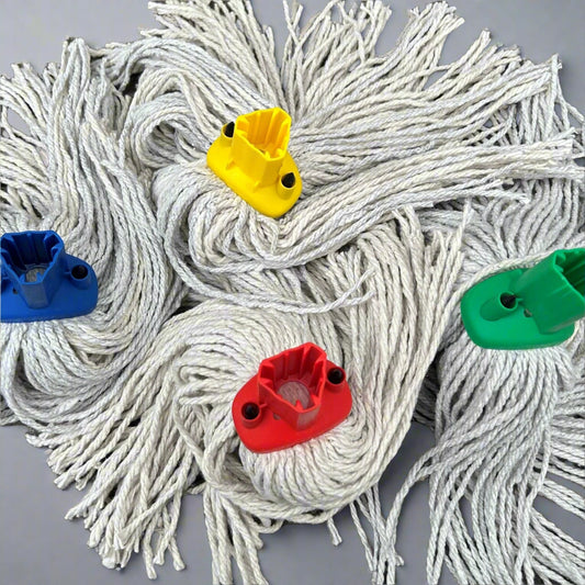 4 mop heads in various colours displayed on a wooden bench to show what fitting the mops have.
