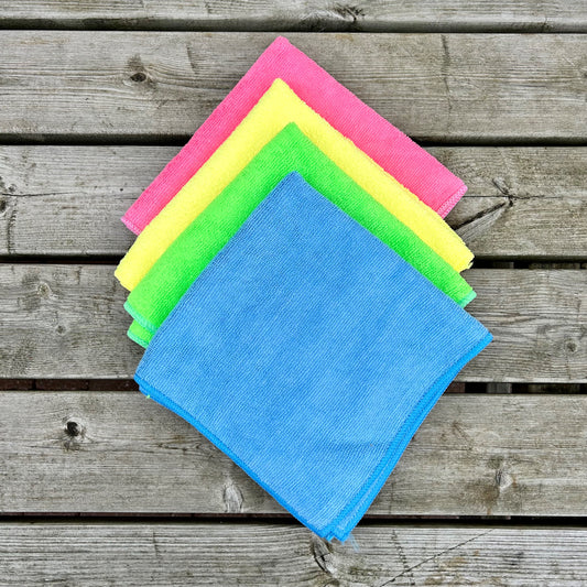 microfibre cleaning cloths in blue, green, yellow and pink. 